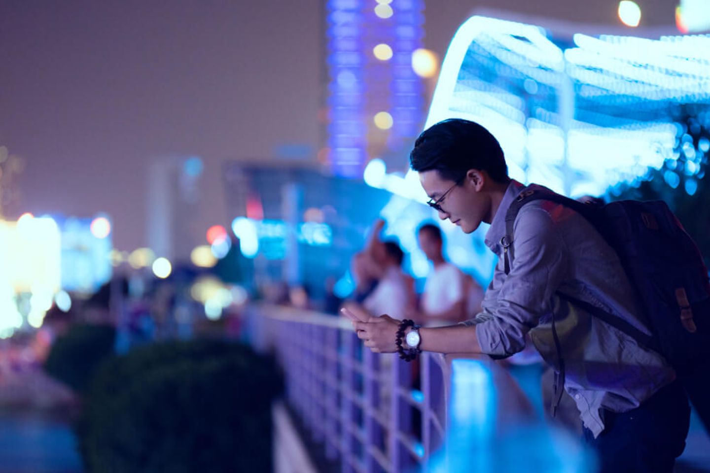 Young man looking at his smartphone