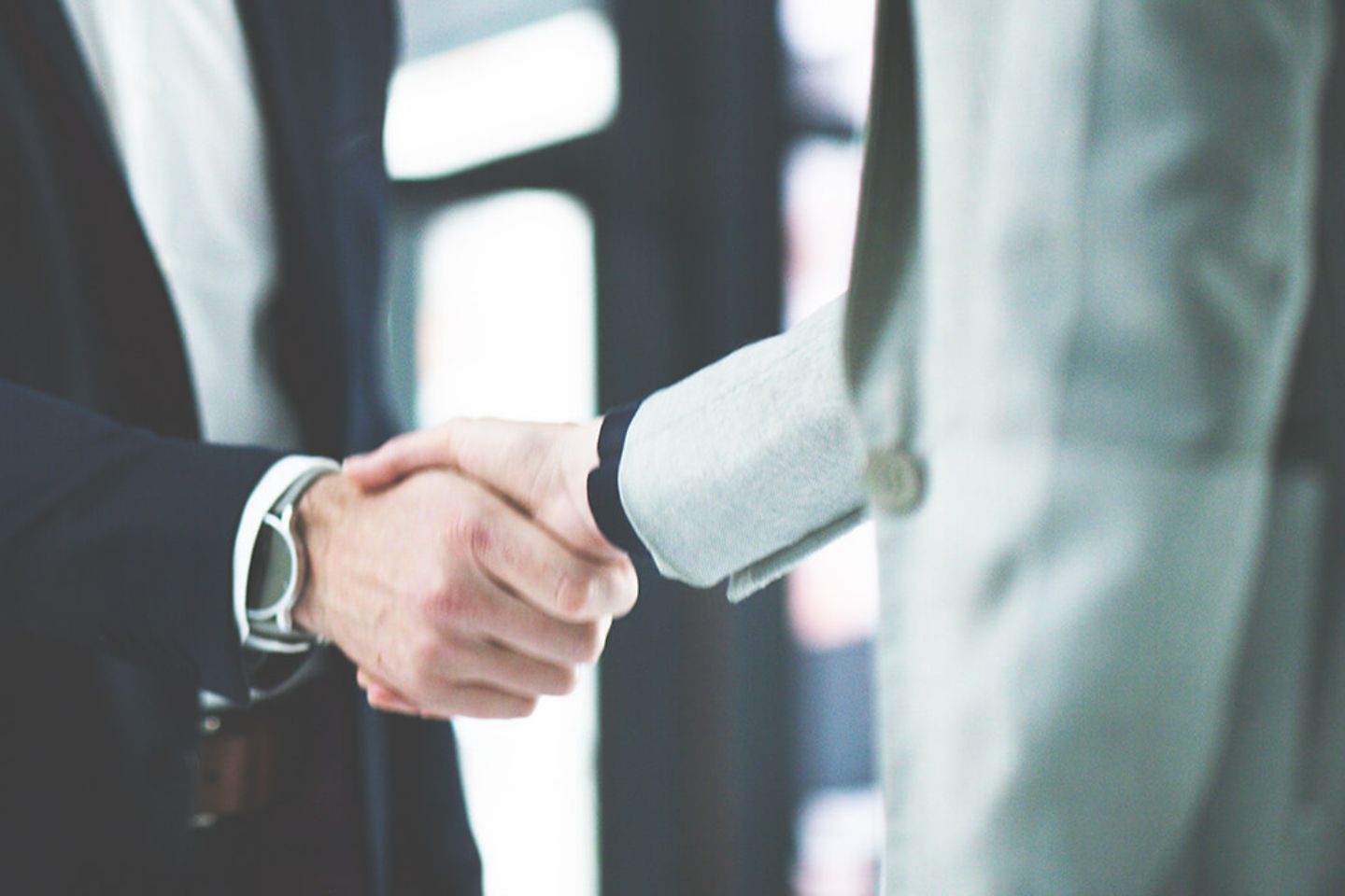 Closeup of two businesspeople shaking hands