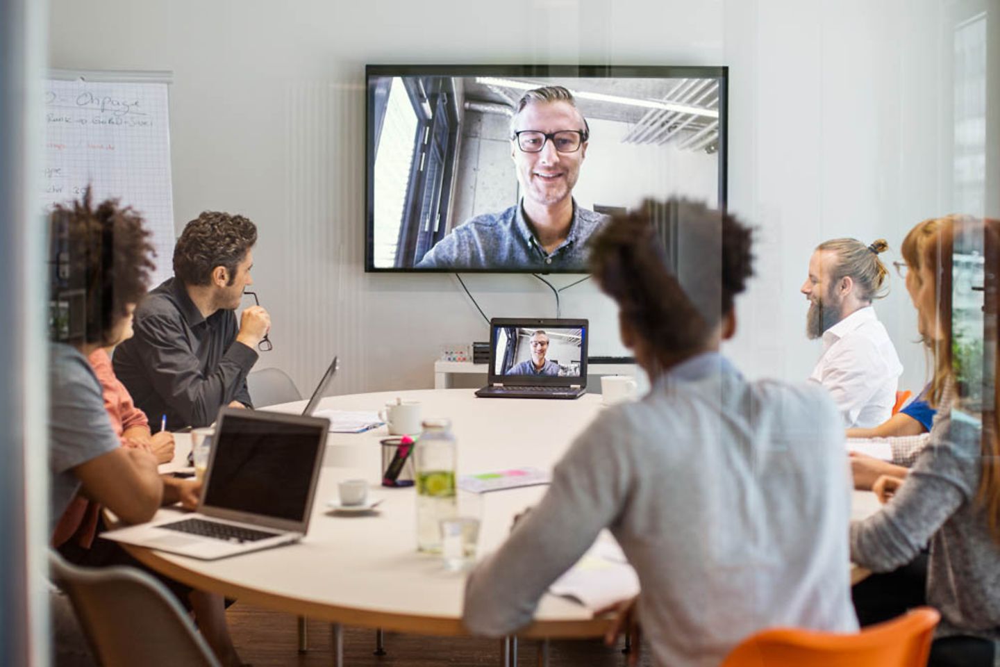 Business people having video conference in meeting room