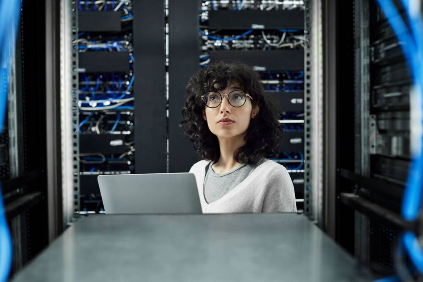 Technician stands in server room