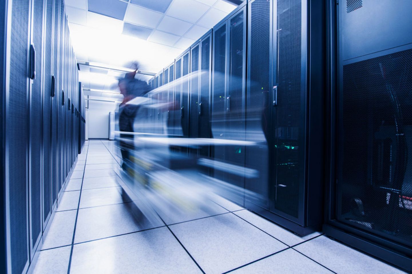 Server room with a blurry figure in it