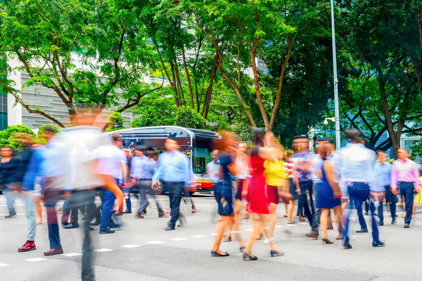 Photo of a crowd of business people walking in the city