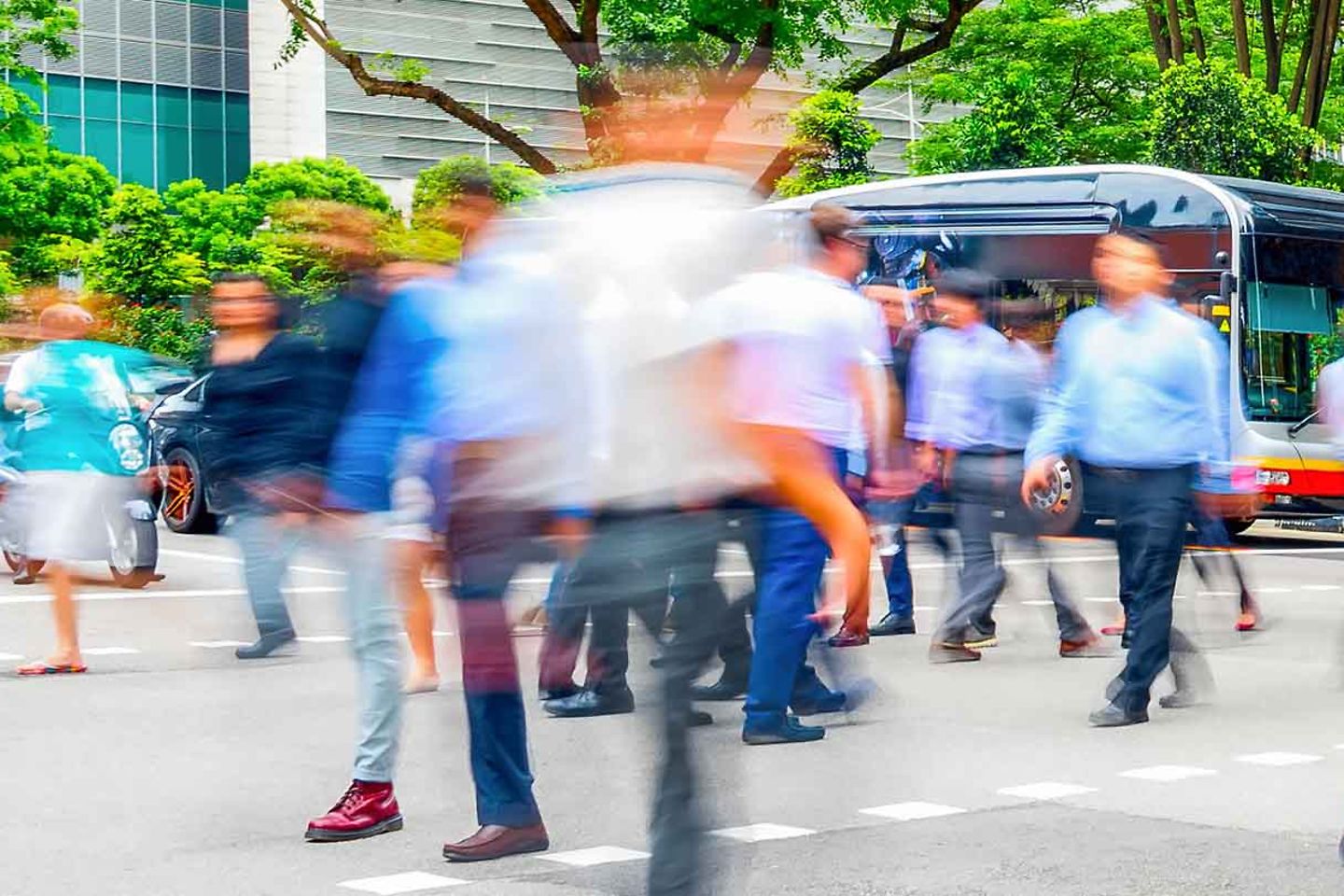 Photo of a crowd of business people walking in the city