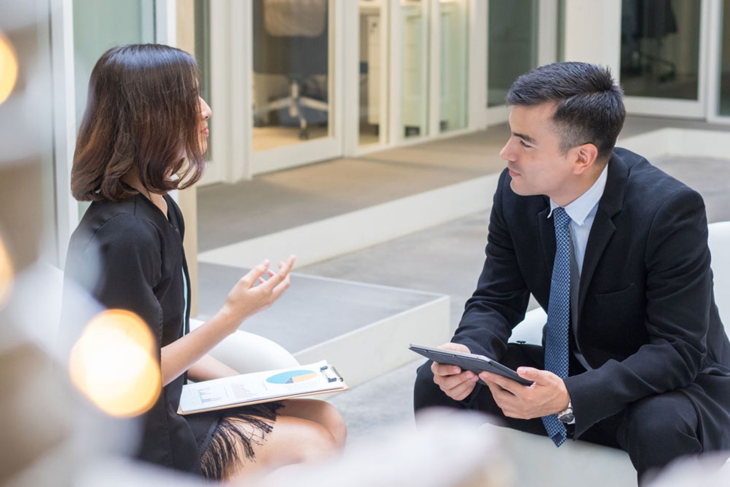 Two work colleagues talking