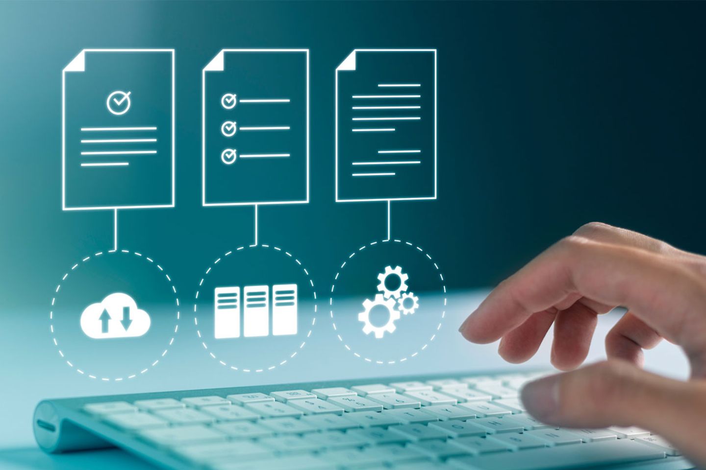 A hand typing into keyboard and computer with cloud access