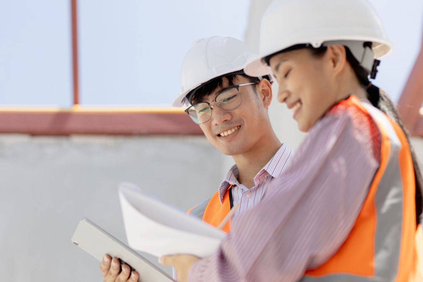 Two engineers working with tablet on-site