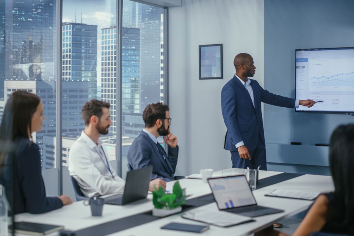 Businessmen sitting in a conference room.