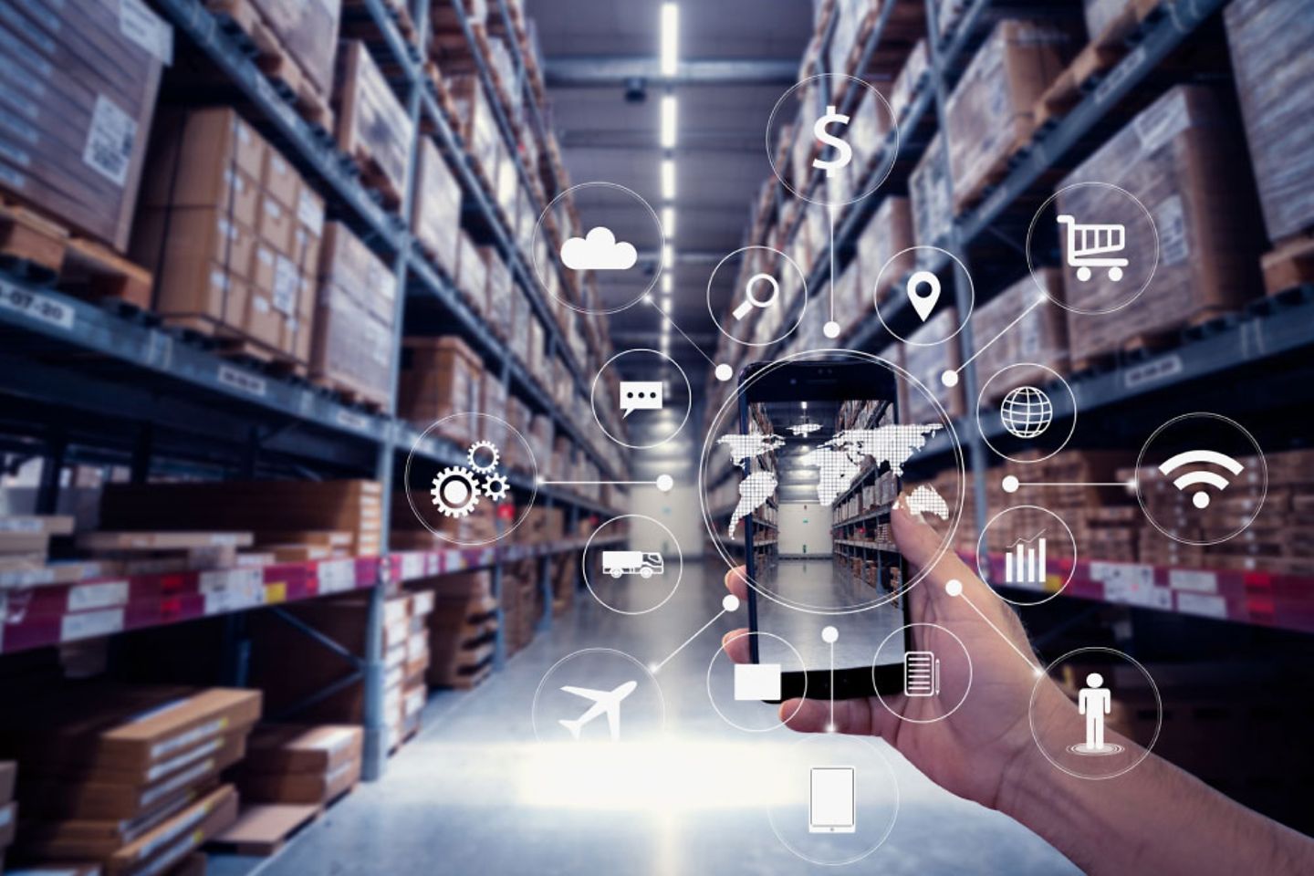 A hand holds a smartphone surrounded by icons in a warehouse
