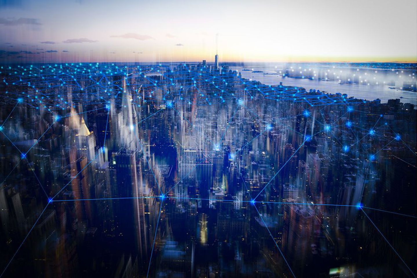 Virtual network symbolized with blue light points over city in the dusk