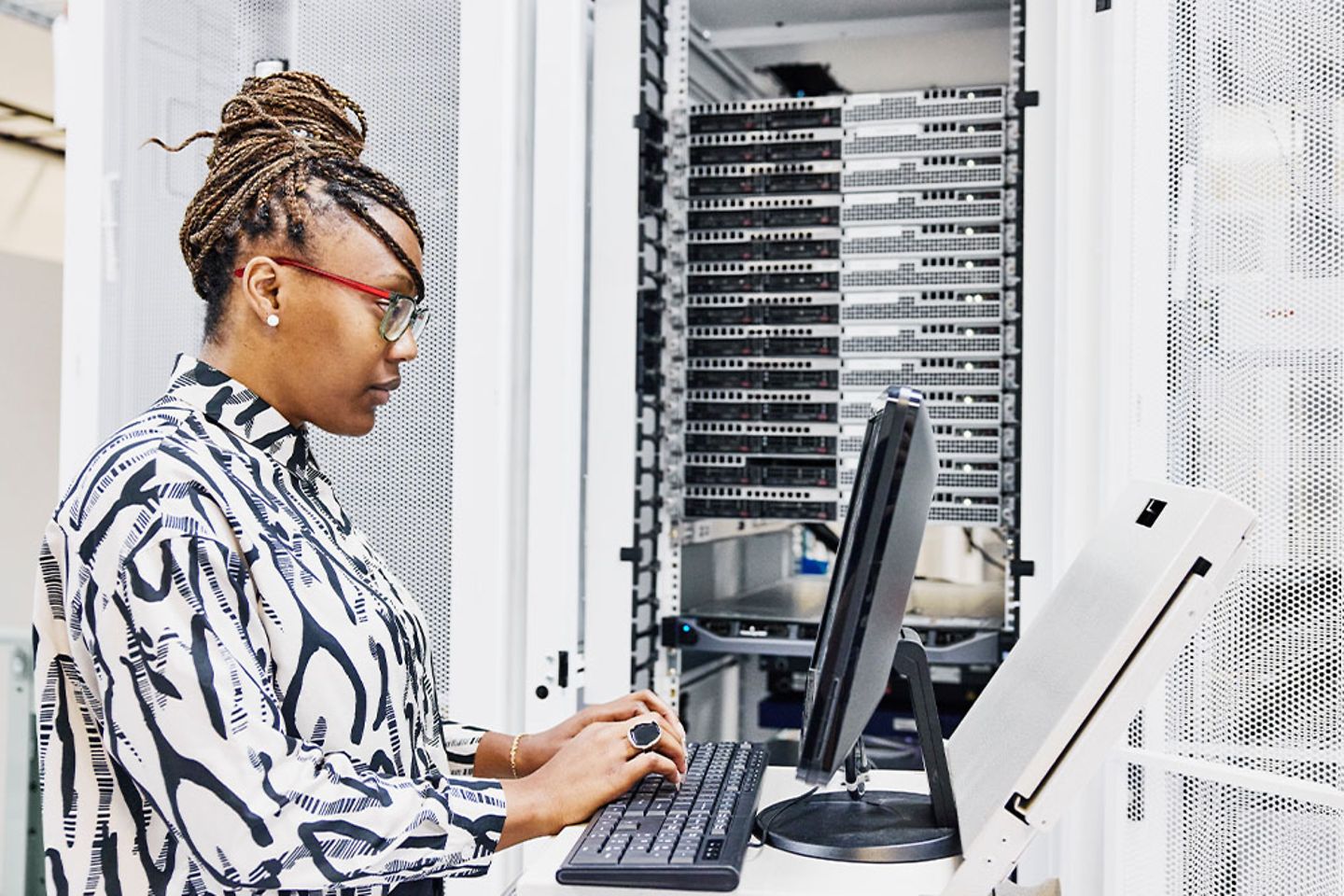 Woman sitting in front of computer screen