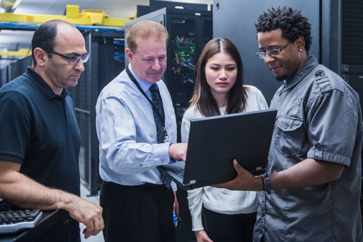 Colleagues work together in a server room