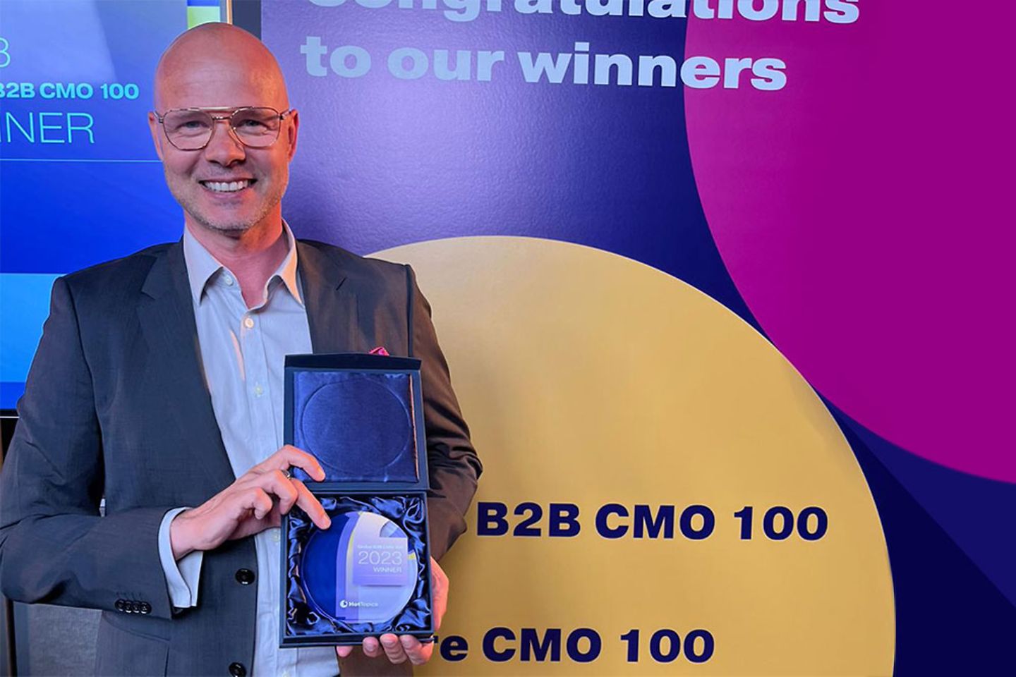 Jussi Wacklin shows off the trophy for CMO of the Year