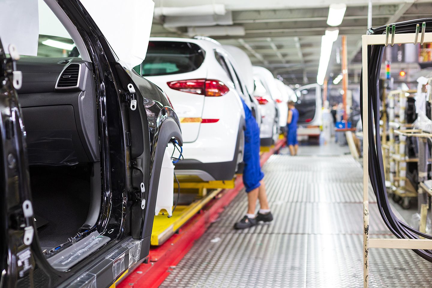 Factory workers on a production line with minimal downtime