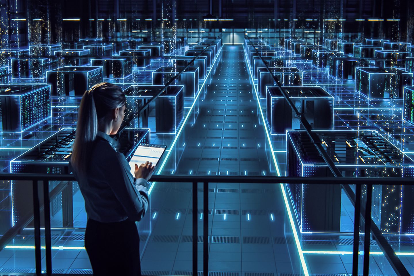 A woman monitoring an advanced manufacturing floor