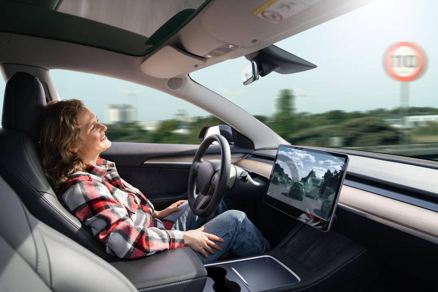 Woman resting in a self driving car with teleoperated concept