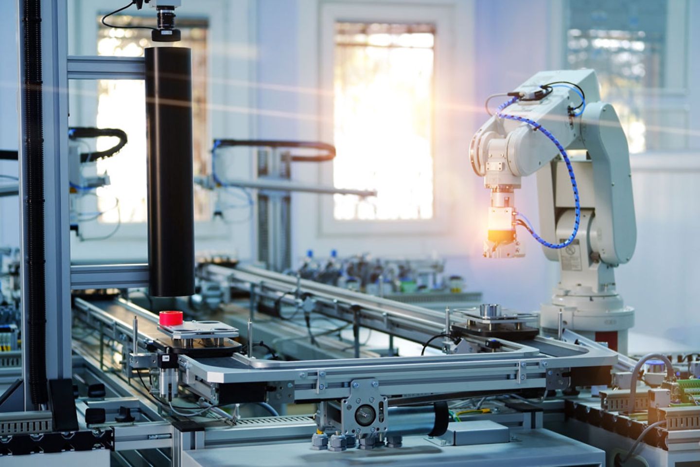 Robot assisting a car production line powered by IIoT and AI