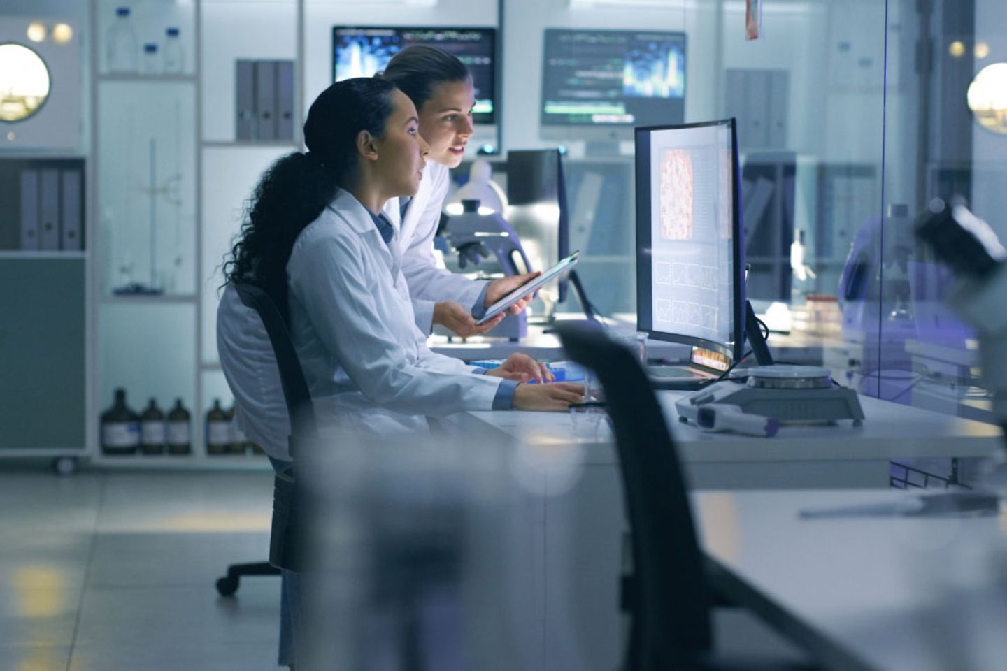 Medical professionals looking at a scan in a laboratory