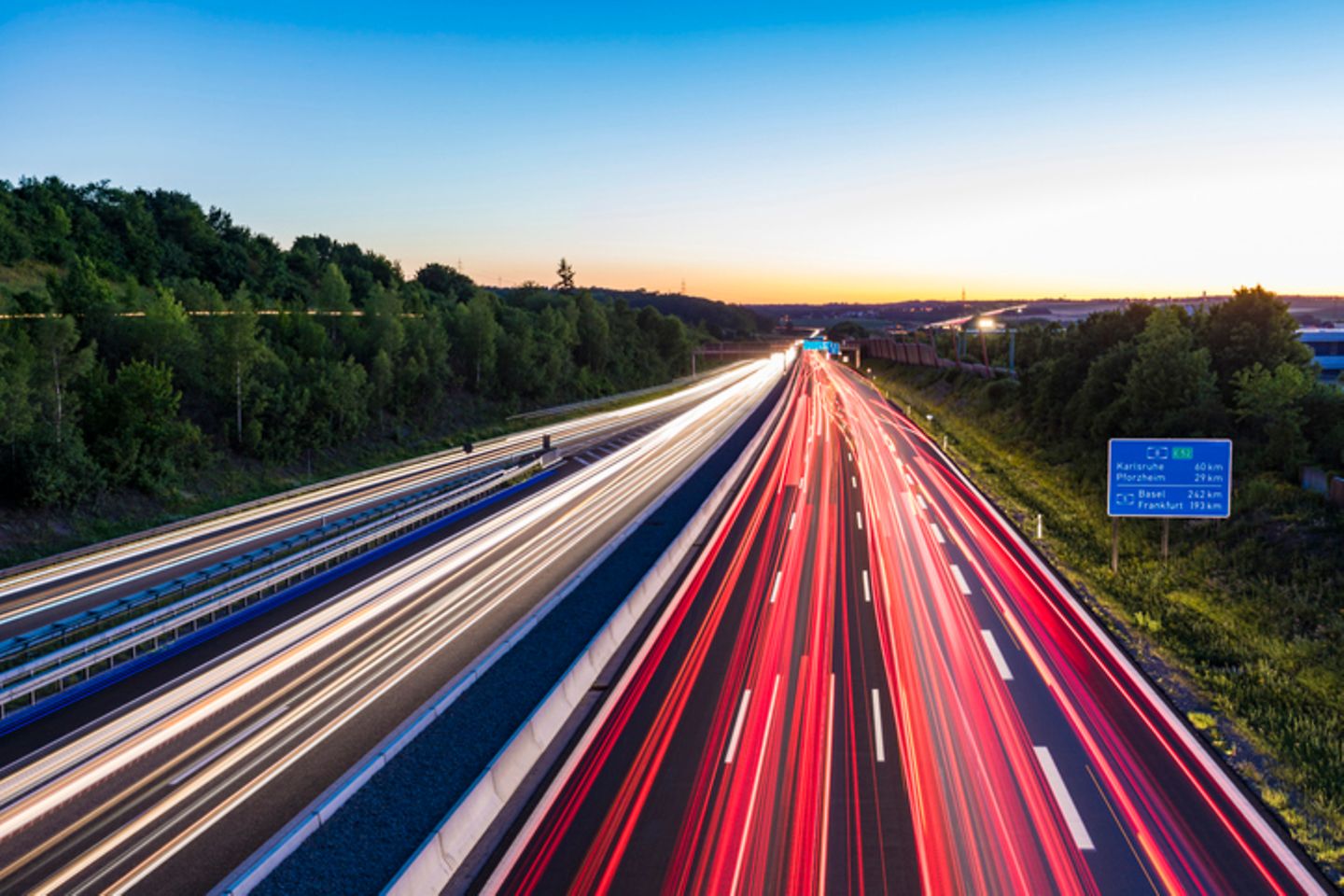 Motorway with light strips stretching along its lanes