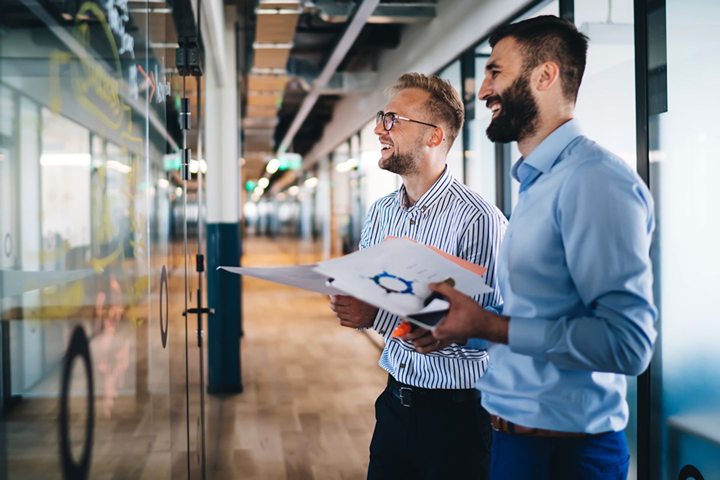 Cheerful male employees planning analytics and optimization