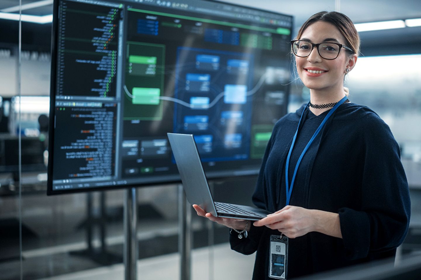 Female software developer using laptop and internet of things