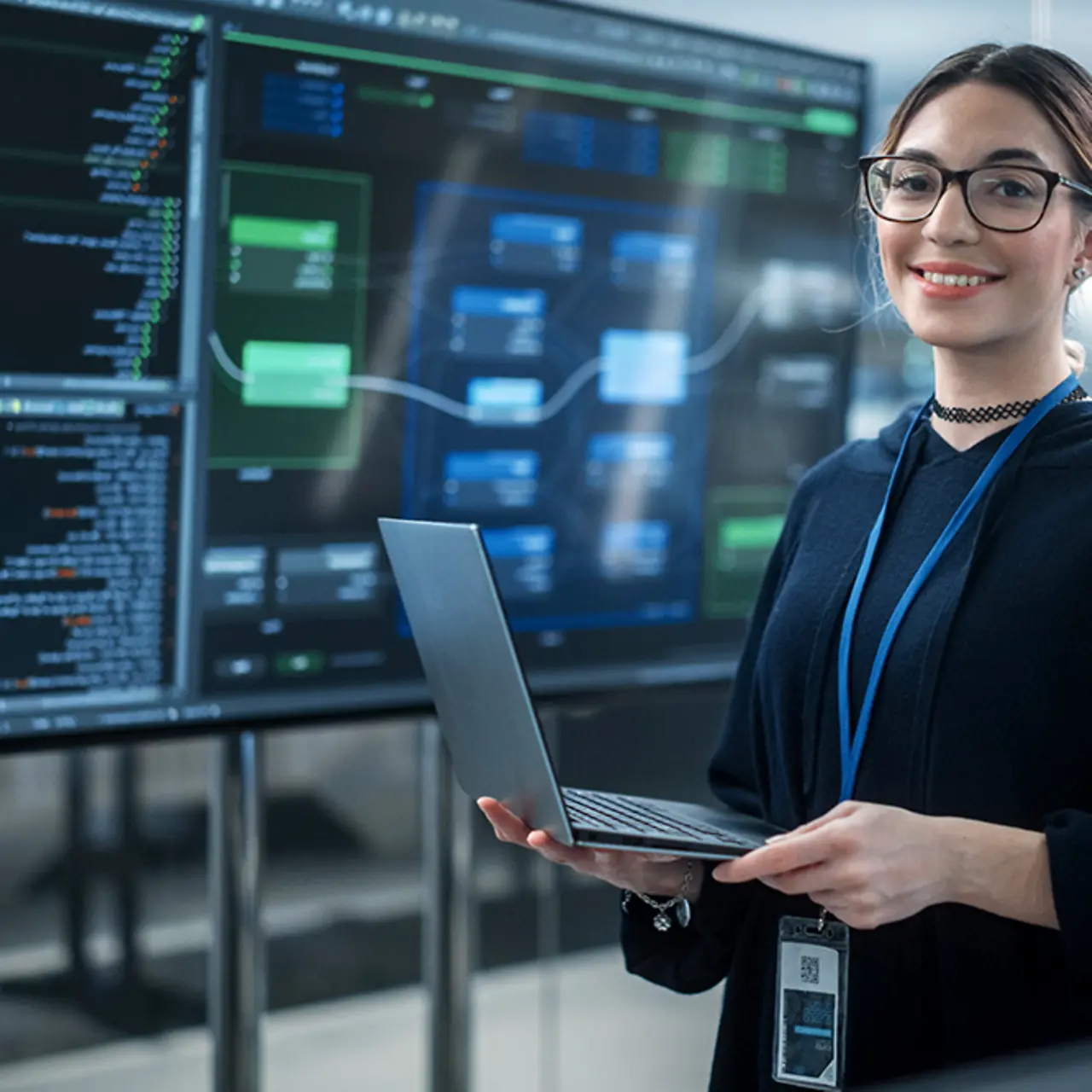Female software developer using laptop and internet of things