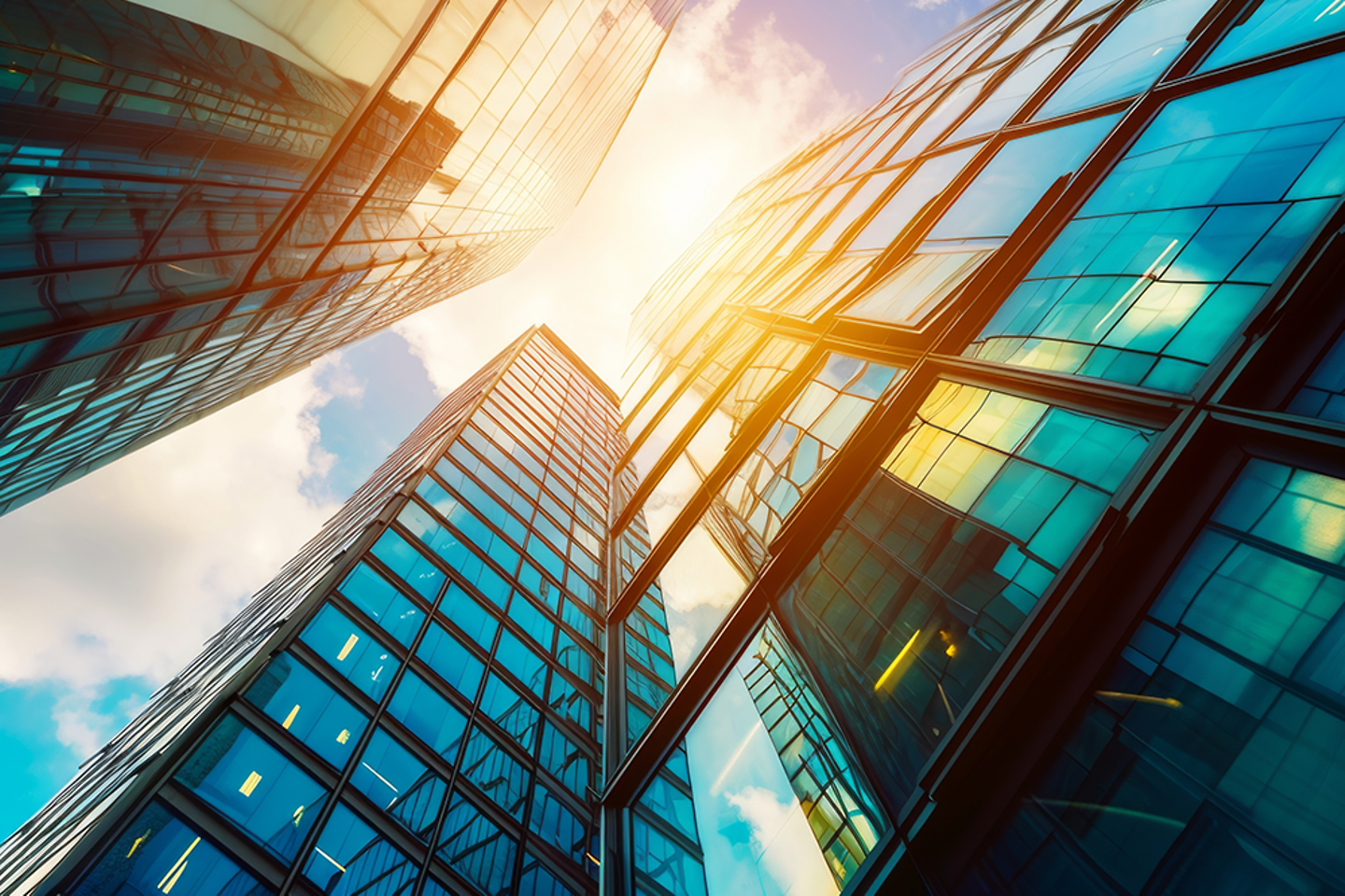 view of modern skyscrapers with converging lines and sky reflections 