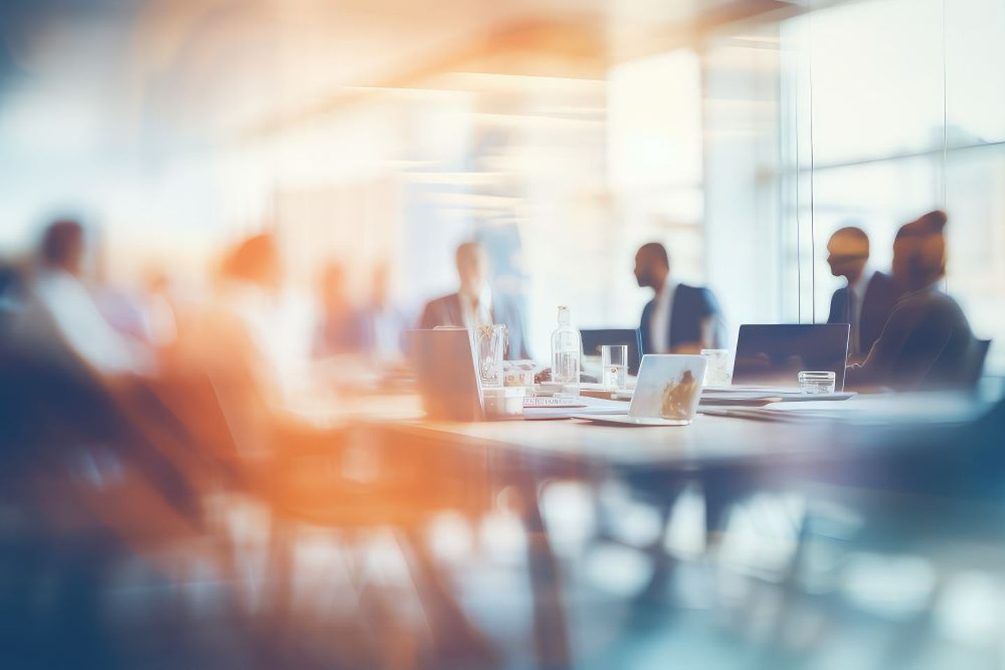 blurred group of people in a meeting