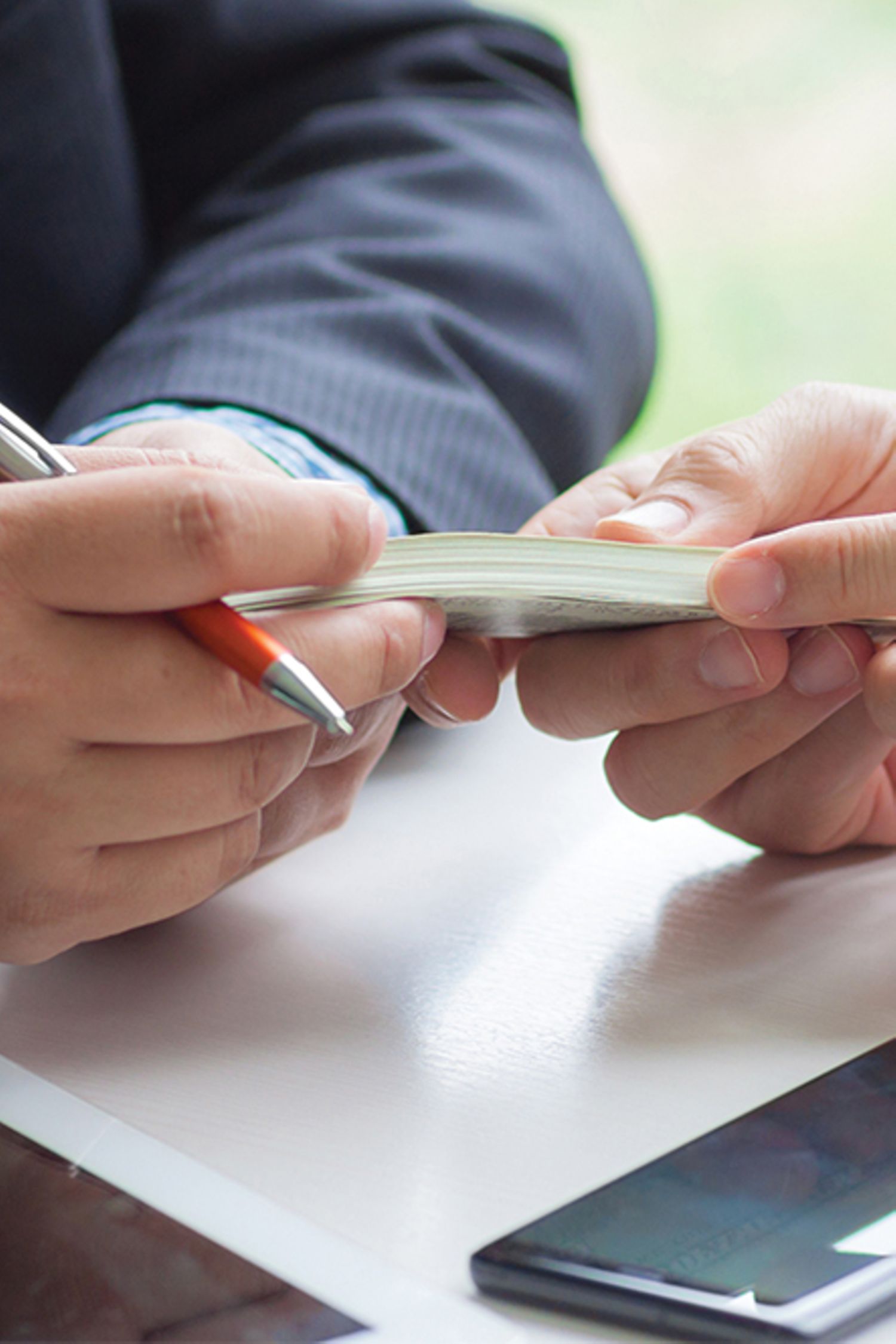 Businessman giving money to businessman