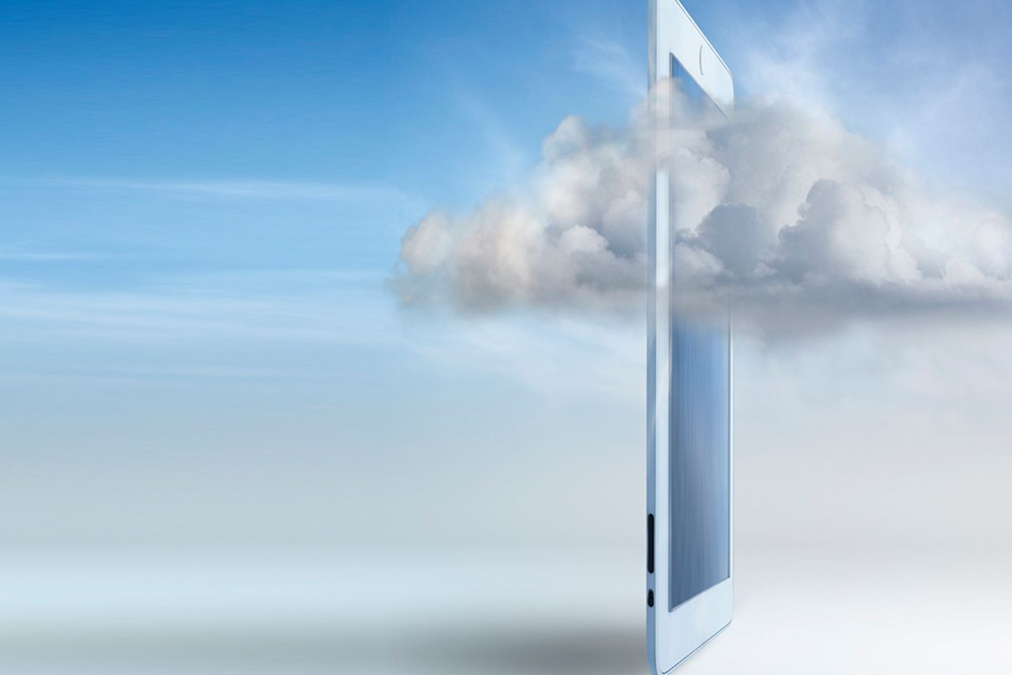 White tablet in front of a bright sky, slightly enveloped by a white cloud.